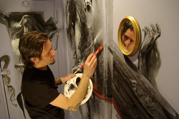 art-project-continues-at-carlton-arms-hotel-tattoo-artist-robert-hernandez-painting-in-2009
